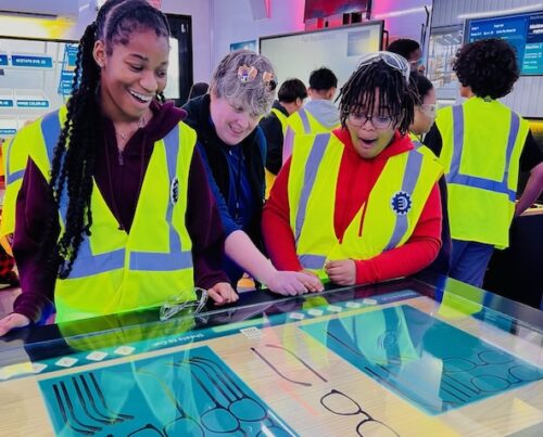 students excited in manufacturing lab