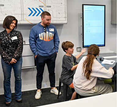 students and teachers in lab