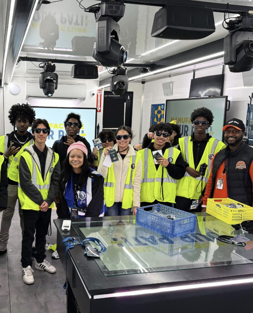 students in yellow vests in the lab