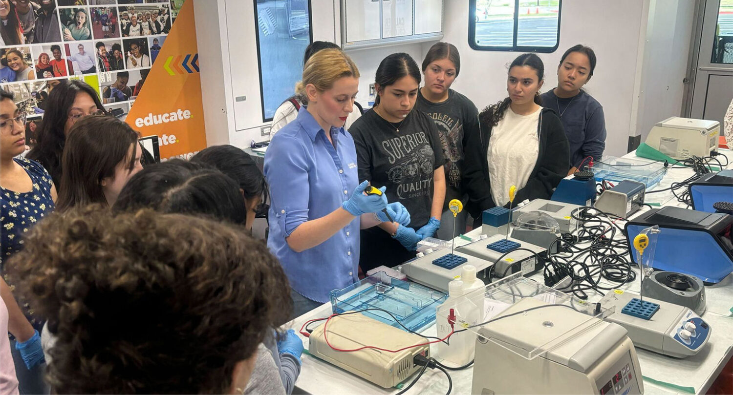 emerging leaders in stem in the lab with teacher showing students