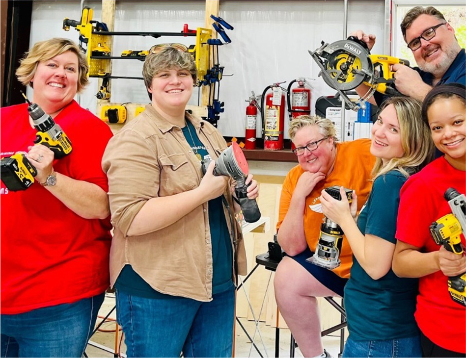 learning undefeated staff and leadership show off their power tools