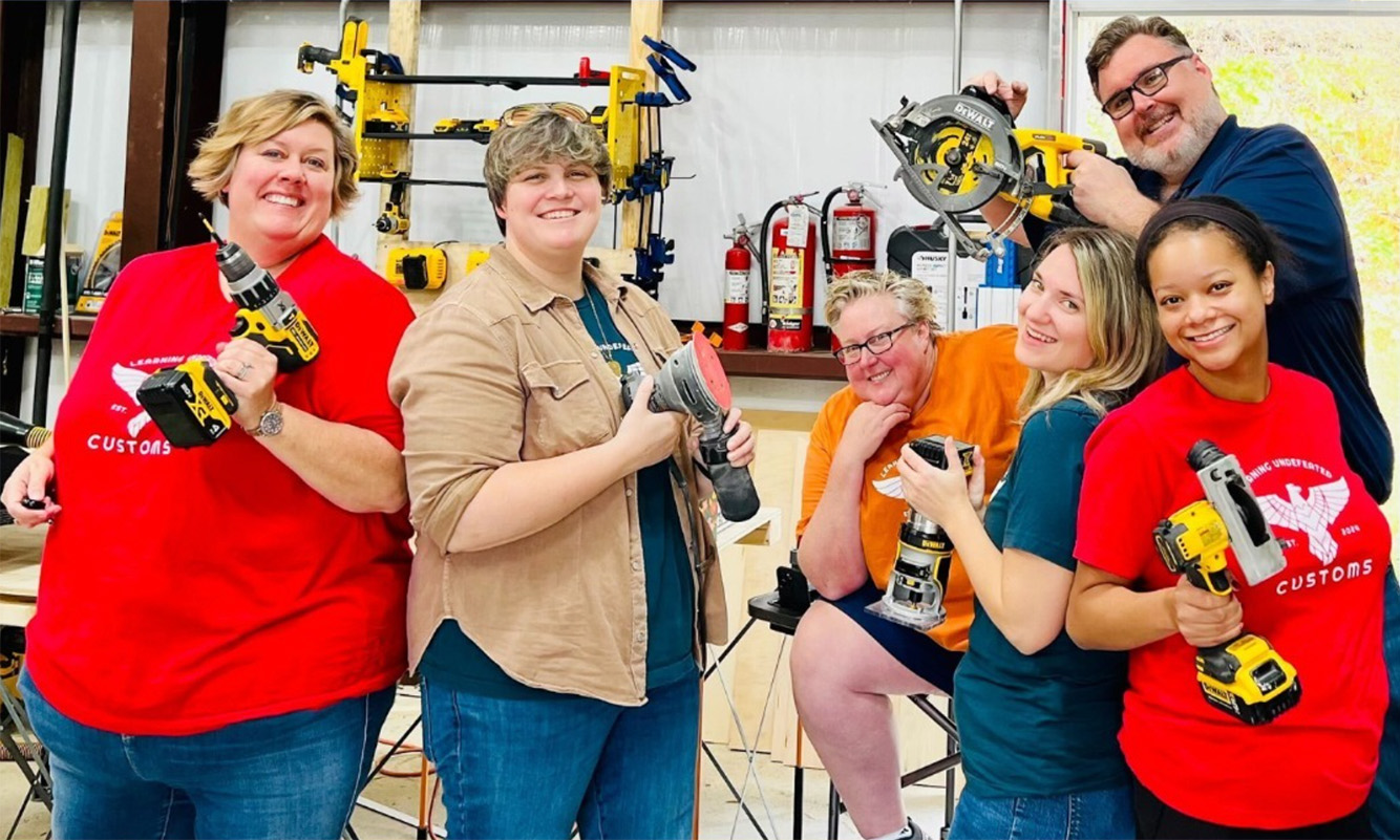 the learning undefeated staff show off their power tools