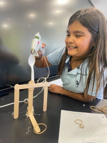 student demonstrating care package launch