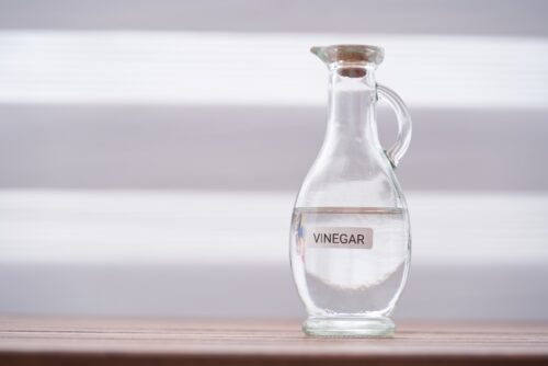 white vinegar on wood table top