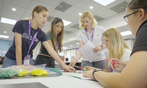 students in biotechnology lab emerging leaders course