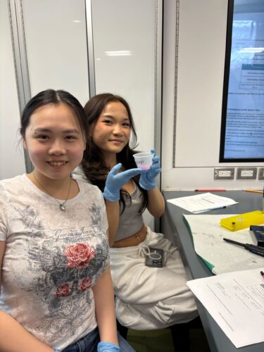 Two girls holding their successful titration